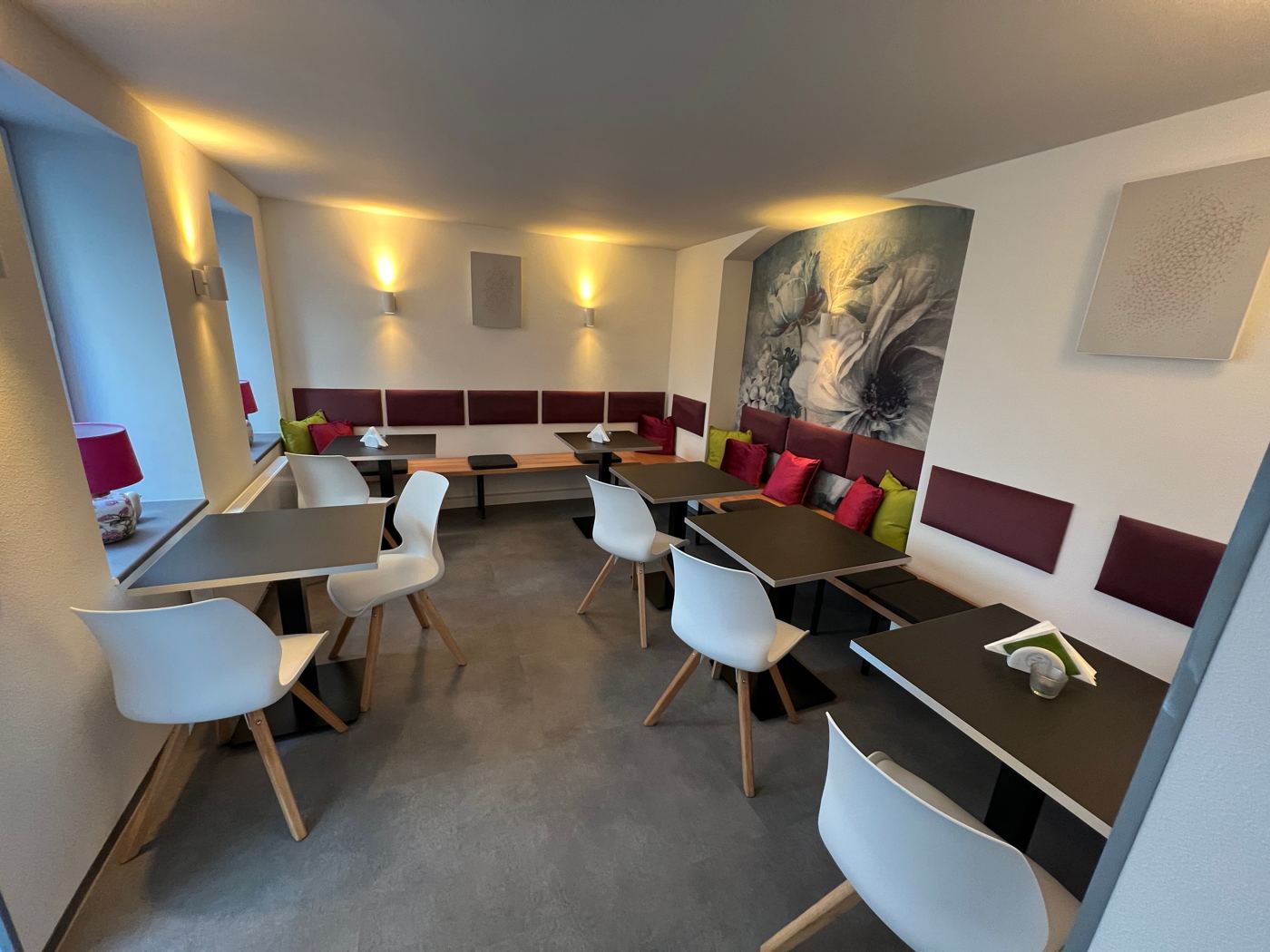 Newly designed breakfast room with benches and tables